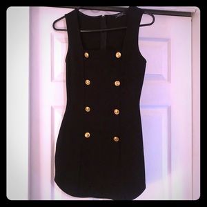 Black dress with gold buttons